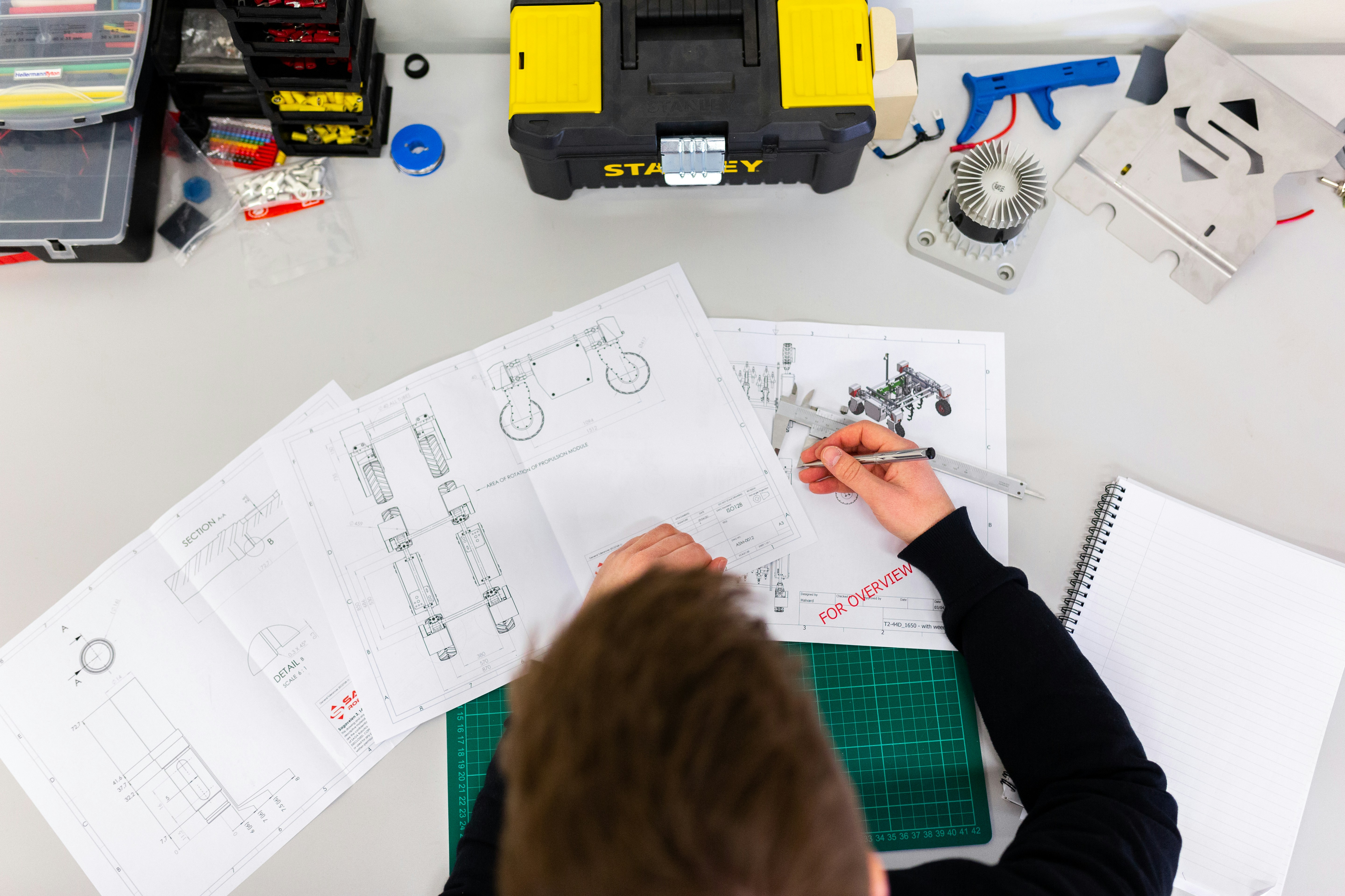 engineer analyzing circuit layout as part of a tutorial guide to applications and solutions Jim Williams